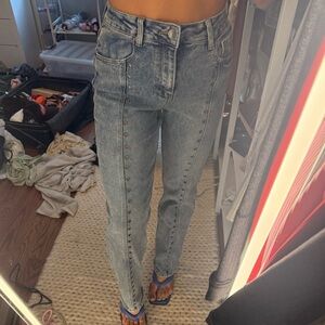 Straight leg jeans with stud holes
